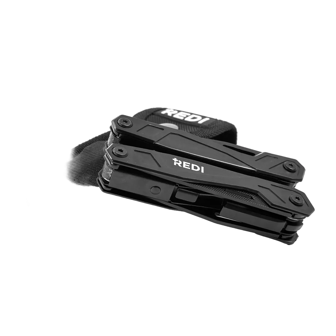 REDI 21-in-1 stainless steel multi-tool, folded closed, with black nylon carry case