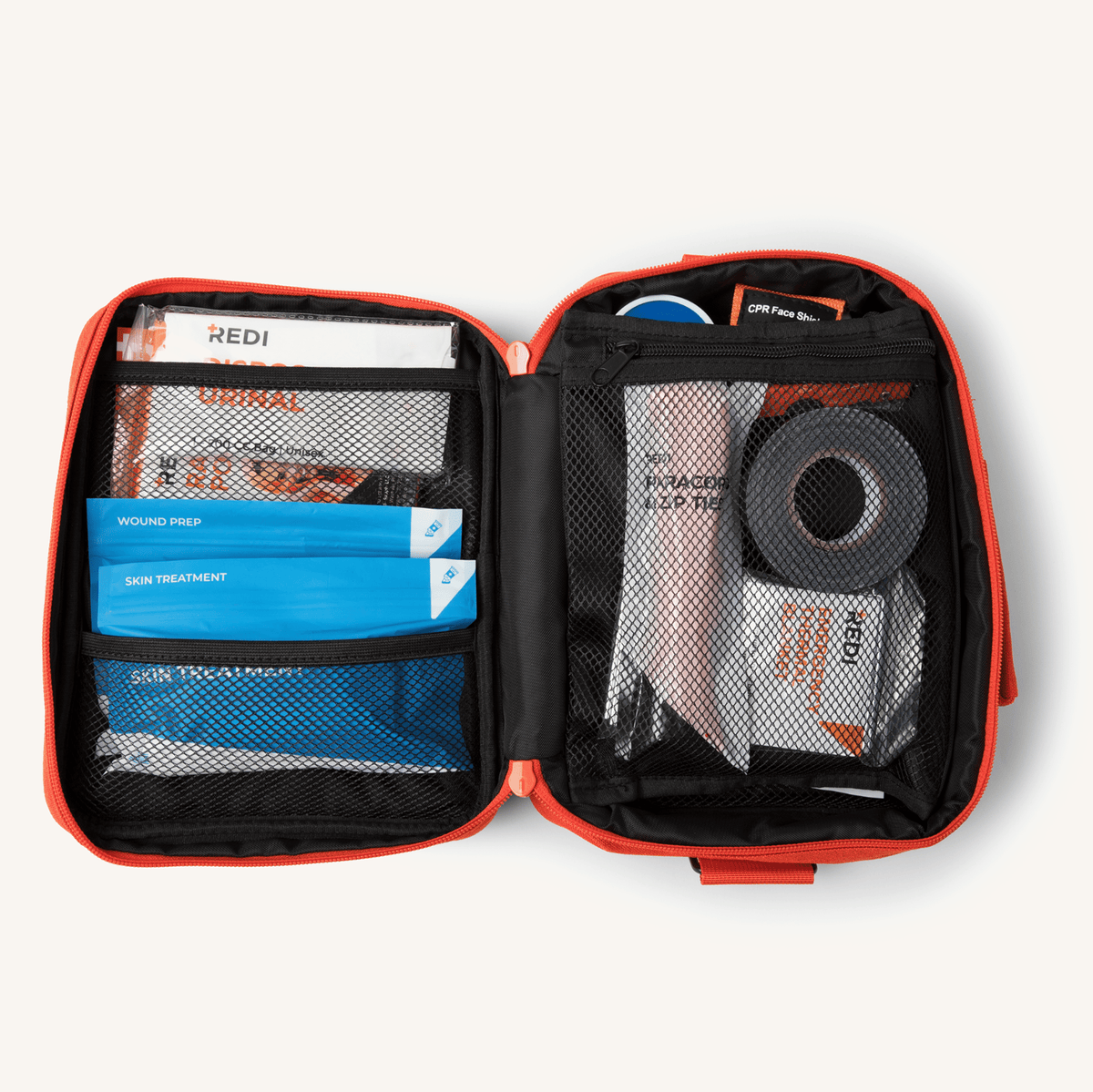 The Roadie readiness kit opened like a book, with labeled first aid pouches in mesh pockets and organized supplies